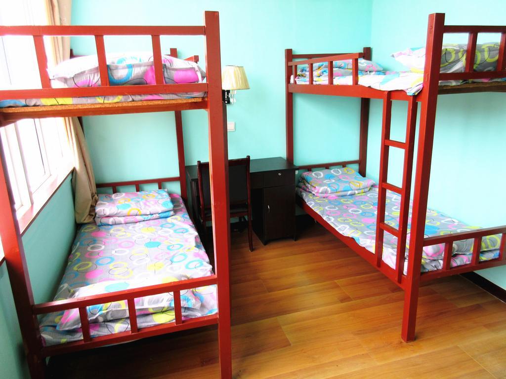 25°C Four Season Youth Hostel Qingdao Kamer foto